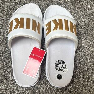 Nike White and Gold Slide Sandals